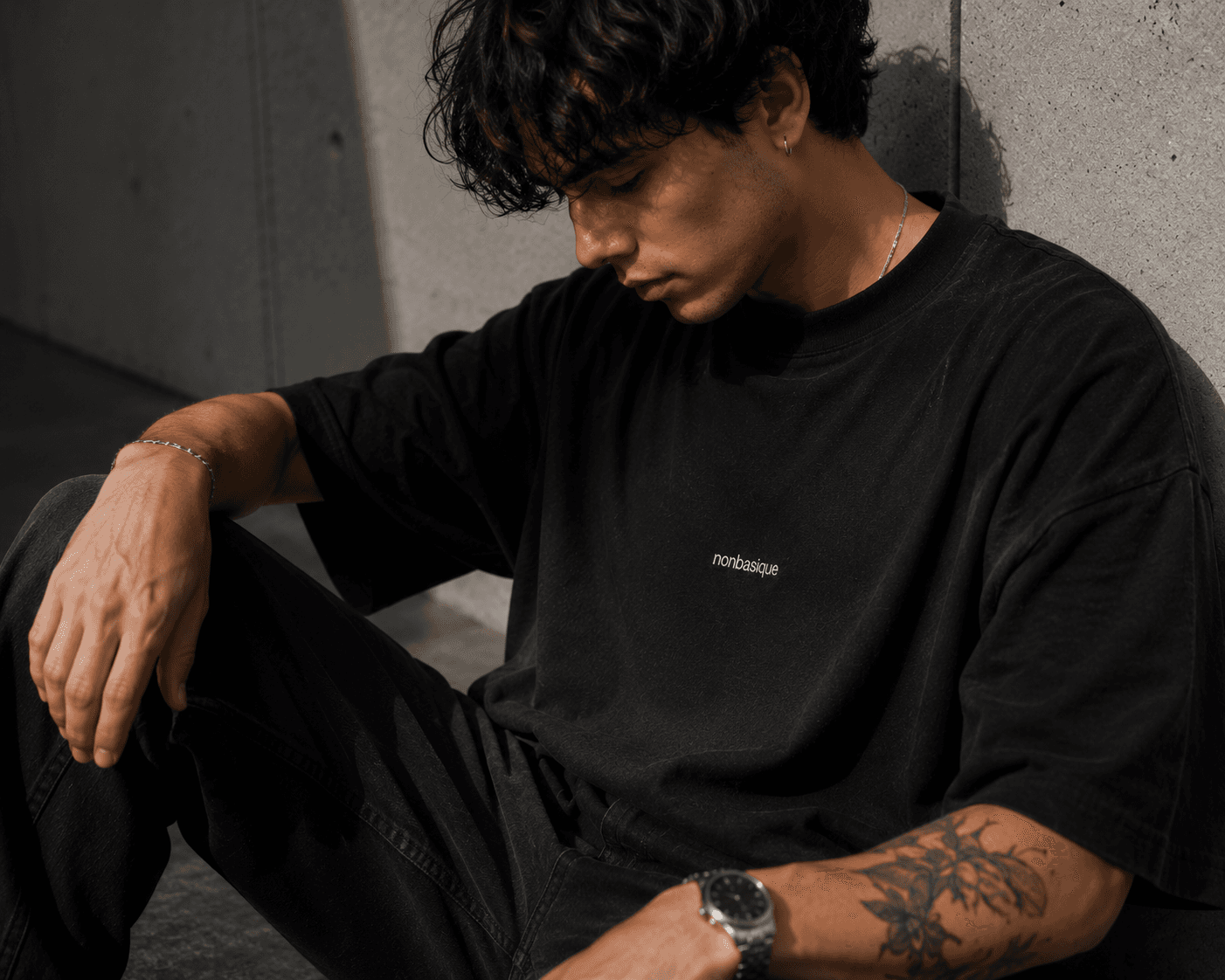 CENTRE 001 in black, on model against concrete